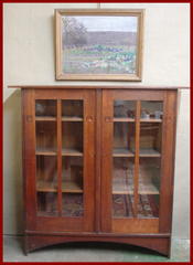 Shown above the Gustave Stickley-Harvey Ellis inlaid bookcase, for scale. 